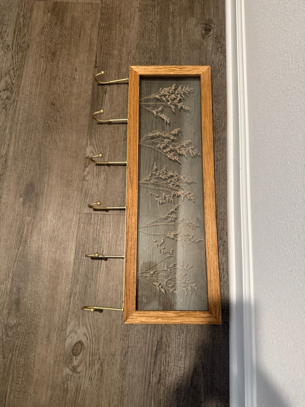 Wood Framed Floral Wall Hook Rack in Oak with Brass Hooks